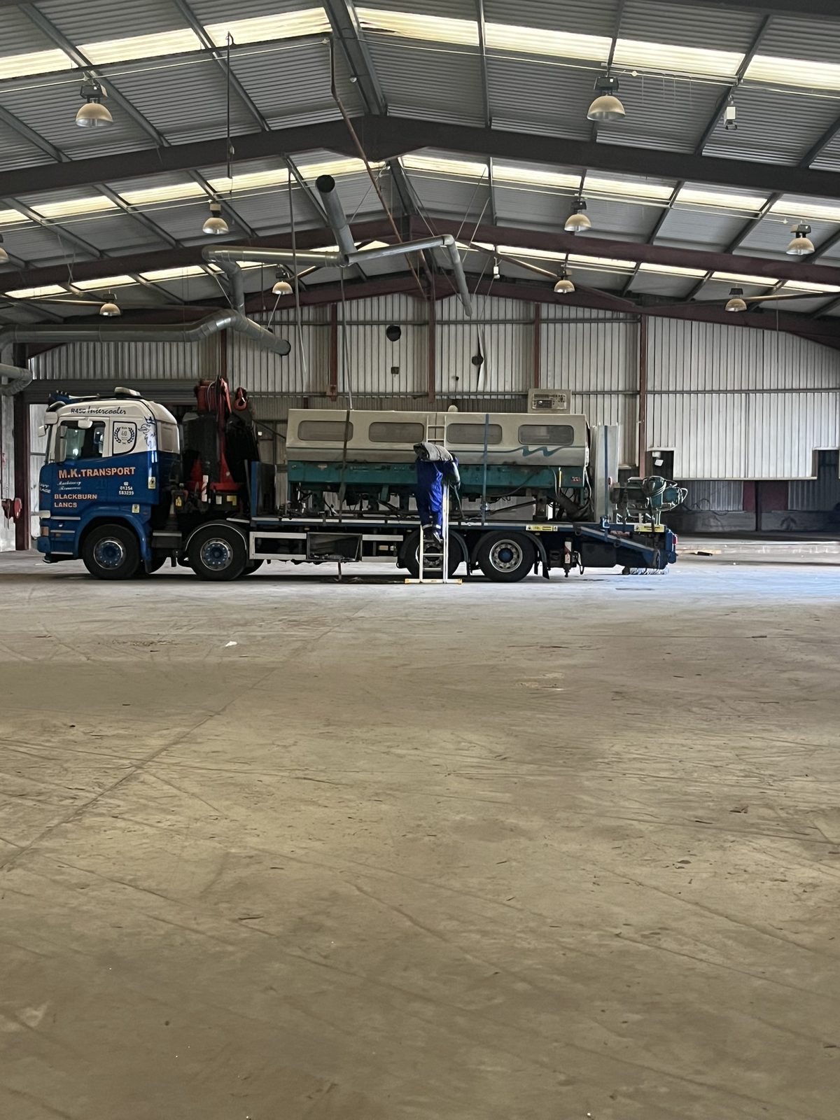 A lorry parked inside the warehouse